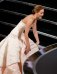 Jennifer Lawrence reacts after she fell walking up the steps to accept the award for best actress at the 85th Academy Awards in Hollywood
